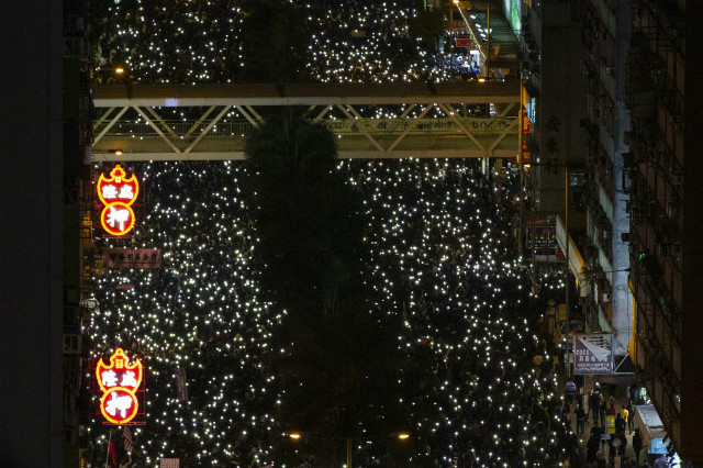 HUGE CROWDS. People raise their phone lights as they take part in a pro-democracy rally in Wan Chai in Hong Kong on December 8, 2019. Photo by Alastair Pike / AFP 