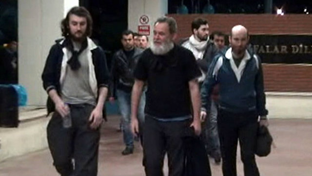 FREE. A screengrab taken on April 19, 2014, from a video released by Dogan News Agency shows the freed French journalists arriving at the Mehmet Akif Inan Training & Research Hospital after 10 months in captivity in Syria. Photo from AFP and DOGAN NEWS AGENCY