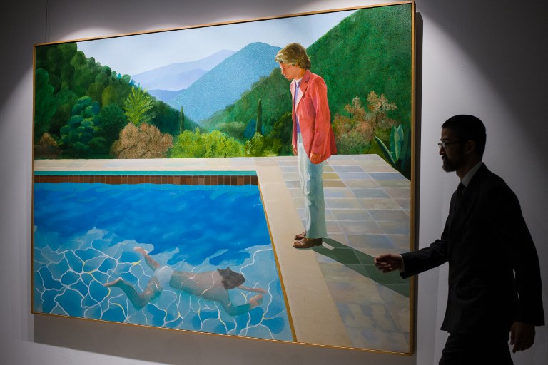 NEW RECORD. English artist David Hockney's 'Portrait of an Artist (Pool with Two Figures)' is displayed during a Christie's auction preview in Hong Kong on September 27, 2018. Photo by Anthony Wallace/AFP  