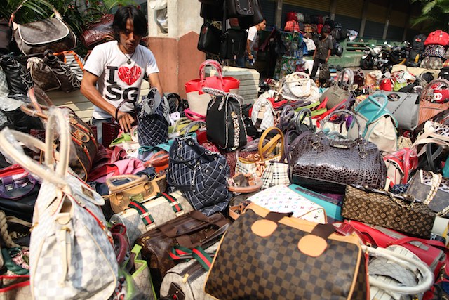 FAKE. Counterfeit bags sold along a street in Jakarta. File photo by EPA 