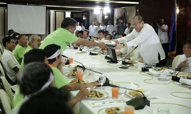 PLEDGE. President Benigno S. Aquino III receives the coconut farmers' proposals and recommendations during a dialogue at the Palace Heroes Hall on November 26, 2014. Photo by Gil Nartea/Malacañang Photo Bureau