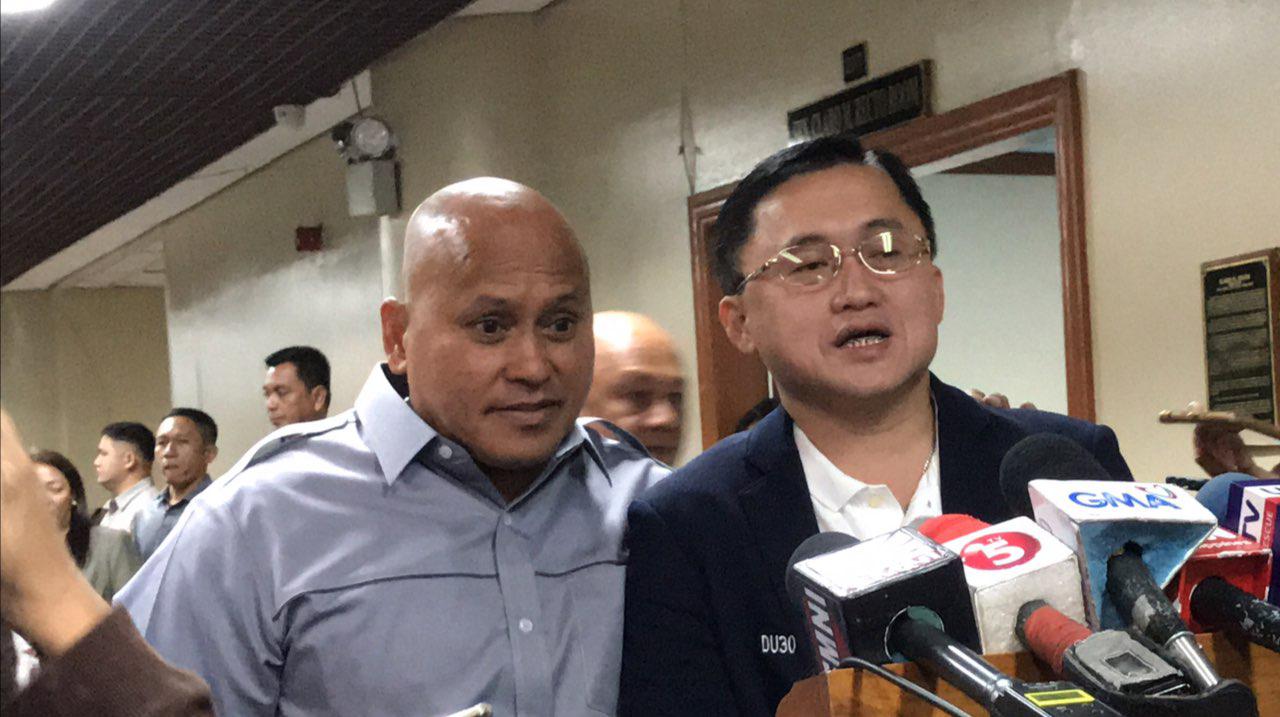 DAVAO BOYS. Senators-elect Christopher Go and Ronald dela Rosa talks to reporters on their 'first day of school' as they attended the orientation on the inner workings of the institution. Photo by Aika Rey/Rappler 