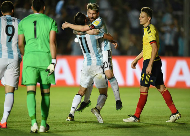VICTORY. Argentina's Angel Di Maria (L) celebrates with teammate Lionel Messi after scoring against Colombia during their 2018 FIFA World Cup qualifier football match in San Juan, Argentina, on November 15, 2016. 
EITAN ABRAMOVICH / AFP 