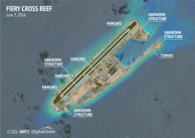 FIERY CROSS REEF. Construction of fighter-jet hangars appears complete at the southern end of the runway and is well-advanced along the middle of the airstrip,€™ the AMTI says of this satellite image dated June 3. Photo courtesy of CSIS/AMTI and DigitalGlobe    