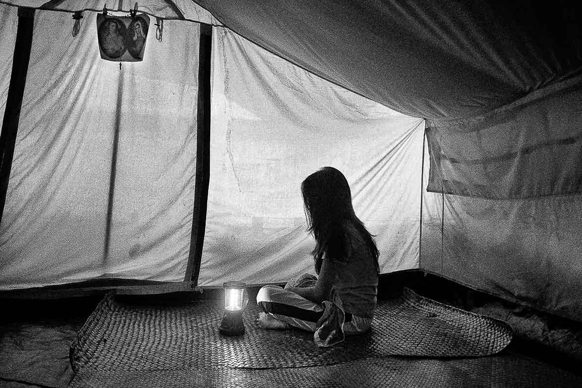 NO SHELTER. A girl who was sexually assaulted while in a temporary shelter prepares to speak to journalists. 
