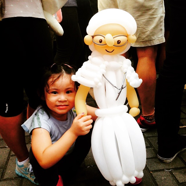 She is Frances, a small girl holding a Pope Francis doll. She promises to hold it up high for the Pope to see when he passes by