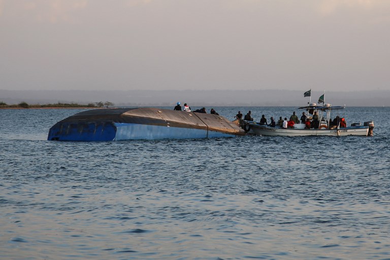 FERRY DISASTER. Investigators on boat work on the capsized ferry MV Nyerere which killed 131 people in Lake Victoria, Tanzania, on September 21, 2018. Photo by AFP 