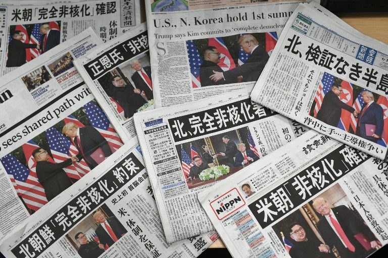 PUBLIC INTEREST. This photo illustration taken in Tokyo on June 13, 2018 shows Japanese daily newspapers with front page coverage of the June 12, 2018 US-North Korea summit in Singapore between US President Donald Trump and North Korea's leader Kim Jong Un. Photo by Martin Bureau / AFP 