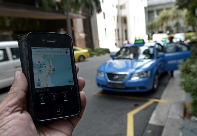 UBER BACK. The Land Transportation Franchising and Regulatory Board allows the transportation giant to operate in the Philippines once more. File photo from Agence France-Presse  