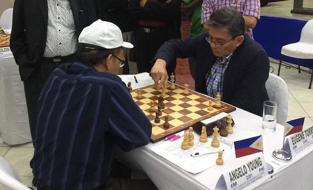 SETBACK. Grandmaster Eugene Torre (right)  absorbs his first loss in 14 games. File photo  