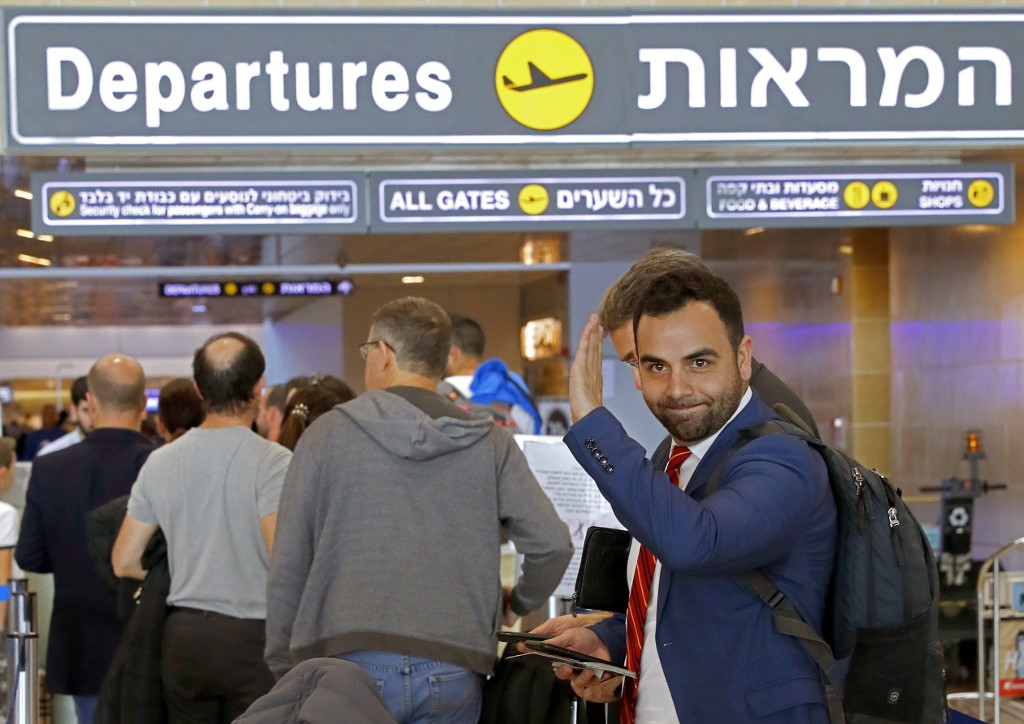 EXPELLED. American citizen Omar Shakir, the director of the New York-based Human Rights Watch for Israel and the Palestinian territories, waves ahead of entering the departures area at Ben Gurion airport on November 25, 2019, after being expelled from Israel. Photo by Jack Guez/AFP 