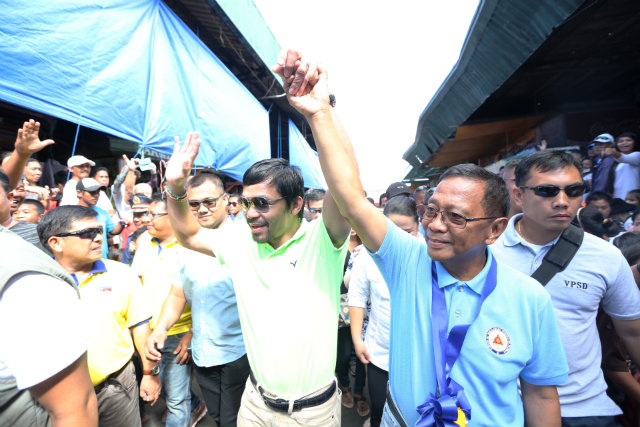 TOP ENDORSER. Boxing champion and Sarangani Representative Manny Pacquiao reinforces Binay's poverty message with his own rags-to-riches story. File photo courtesy of OVP   