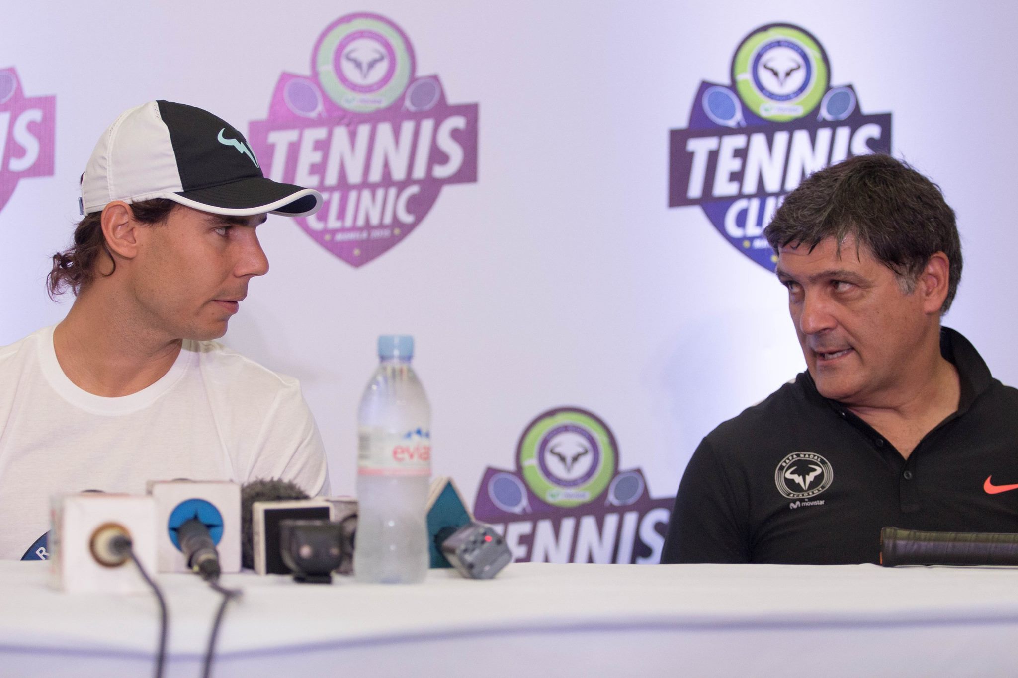 NADAL IN MANILA. Rafael Nadal and uncle/coach Toni Nadal look at each other during a media briefing. Photo by Ena Terol/Rappler 