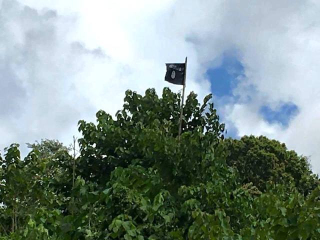 BLACK FLAG. This 'ISIS' flag was found hoisted in the camp of the criminal group in Palimbang town, Sultan Kudarat. Photo from Palimbang Facebook page   
