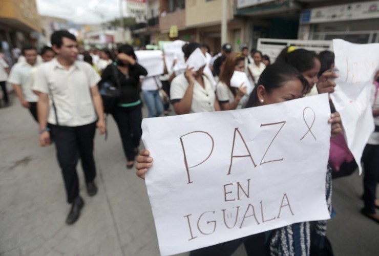 Students protest in demand of justice for the deaths of six people including students of Ayotzinapa and football players of the team 