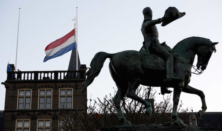 The Dutch flag flies at half mast above the first chamber in The Hague, the Netherlands, 10 November 2014, during the national commemoration for the victims of Malaysian Airlines flight MH17, which crashed in eastern Ukraine on 17 July. Martijn Beekman/EPA