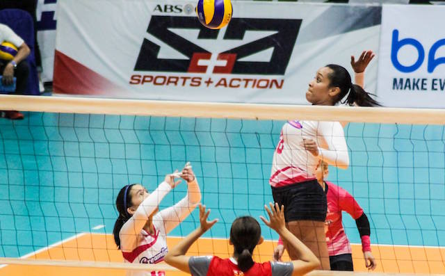 GROWING CHEMISTRY. Creamline setter Jia Morado (left) dishes the ball to middle blocker Aleoscar Blanco. Photo by SportsVision 