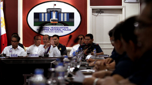 PNP, PNPA ISSUES. DILG Secretar Mar Roxas (L) and PNP chief Director General Alan Purisima (R) flank President Benigno Aquino III during a April 14 PNP Command Conference in Camp Crame. File photo by Photo by: Rey Baniquet/Malacañang Photo Bureau