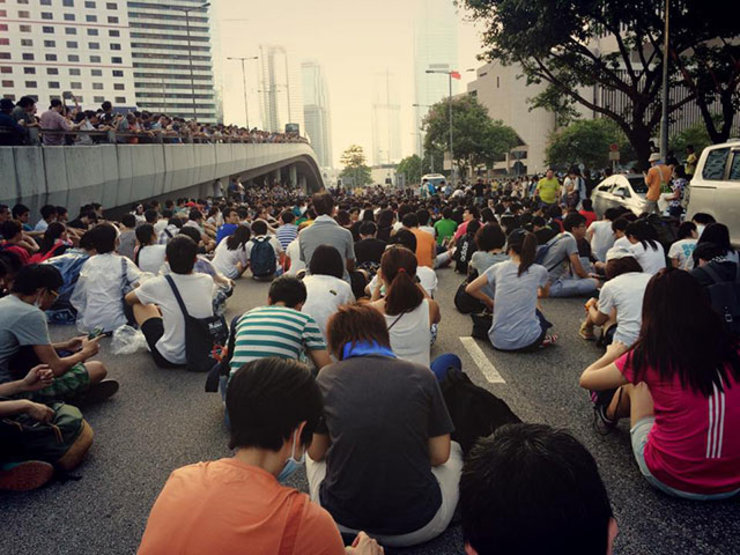 PEACEFUL PROTESTS. Occupy Central protestors sit on a street in Hong Kong. Photo by Jason Y Ng 