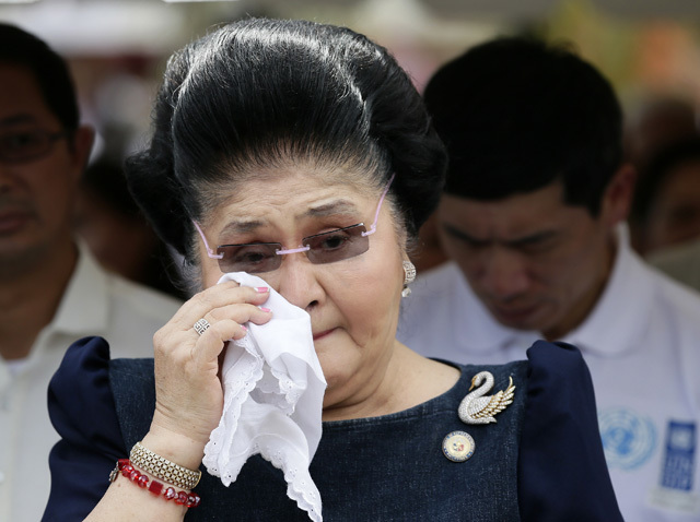WEEPING IMELDA. Ilocos Norte Representative Imelda R. Marcos tears up during the one-year anniversary of Super Typhoon Yolanda in Leyte. EPA file photo 