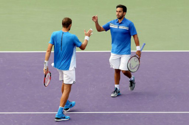 DOUBLE TROUBLE. Treat Huey and Max Mirnyi come ever so close to the men's doubles final but fall to their French foes. File photo by Matthew Stockman/Getty Images/AFP  