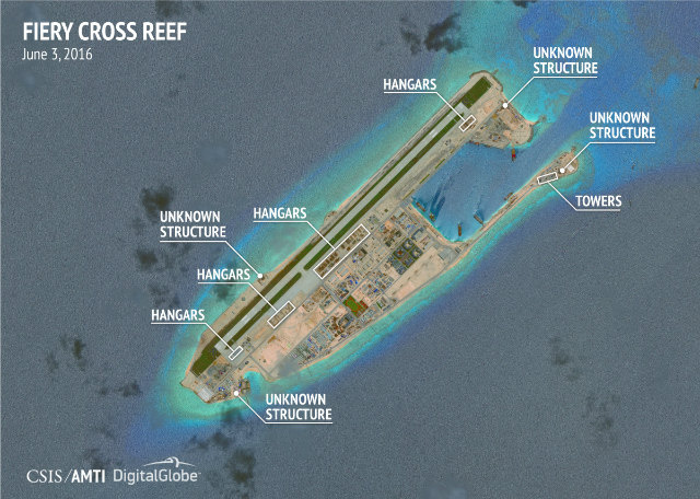 FIERY CROSS REEF. Construction of fighter-jet hangars appears complete at the southern end of the runway and is well-advanced along the middle of the airstrip, the AMTI says of this satellite image dated June 3. Photo courtesy of CSIS/AMTI and DigitalGlobe   