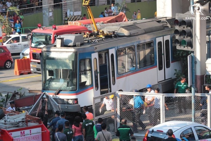 ‘TECHNICAL GLITCH.’ One and a half coaches of the MRT train breach the barrier of the Taft Station in Pasay City, injuring some of its passengers, on August 13, 2014. Photo by Joel Leporada/Rappler