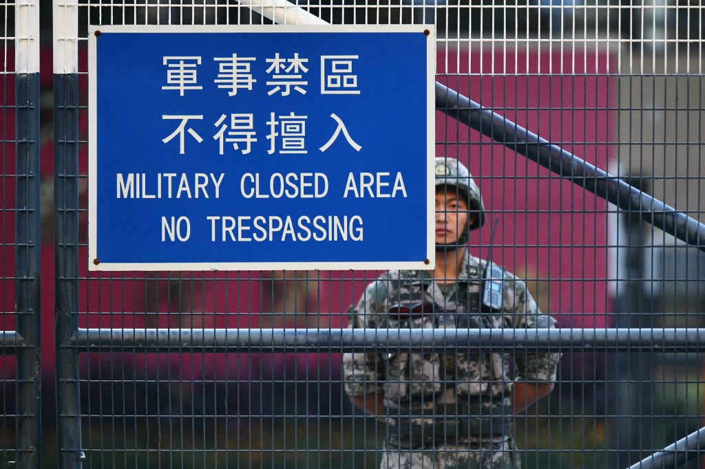 CHINA ARMY. A member of Chinaâs People's Liberation Army (PLA) stands guard inside Osborn Barracks in Kowloon Tong in Hong Kong on November 16, 2019. Photo by Anthony Wallace/AFP 