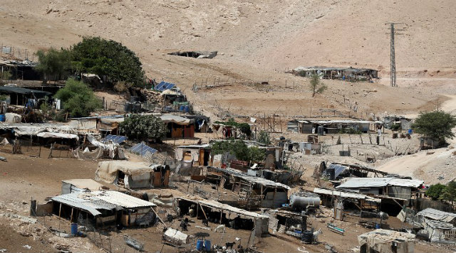 POSTPONED. This picture shows the village of Khan al-Ahmar in the Israeli-occupied West Bank on September 6, 2018. Photo by Ahmad Gharabli/AFP 
