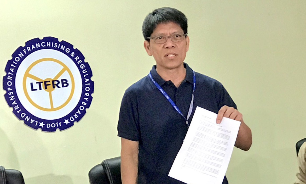 SUSPENSION CONVERTED. LTFRB Chairman Martin Delgra III faces media to explain their stand on transport network companies. File photo by Rambo Talabong/Rappler  