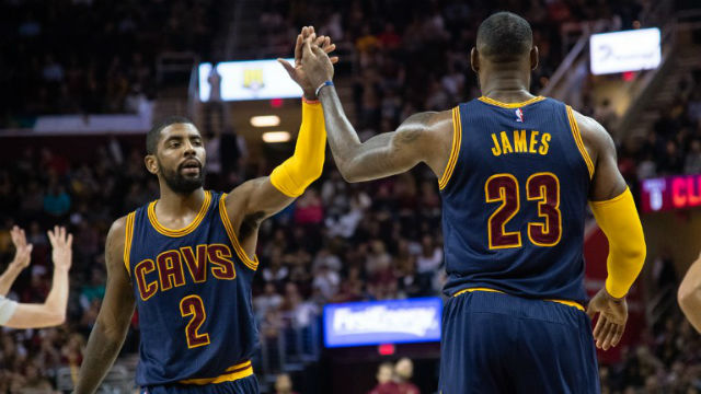 KEEP ON ROLLING. Kyrie Irving (2) and LeBron James (23) share a moment during the Cavs' latest win over Boston. Jason Miller / GETTY IMAGES NORTH AMERICA / AFP 