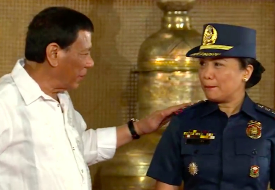 ASCENSION. President Rodrigo Duterte gives a tap on the shoulder of Royina Garma right after she was promoted to Senior Superintendent on June 13, 2018. RTVM screenshot.   