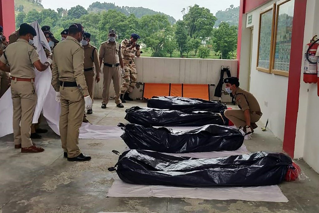 DOOMED. Handout shows ITBP personnel line up the bodies of mountaineers retrieved from Nanda Devi after landing in a helicopter in Pithoragarh in the Indian state of Uttarakhand on July 3, 2019. 
Photo by Handout/Indo Tibetan Border Patrol/AFP
  