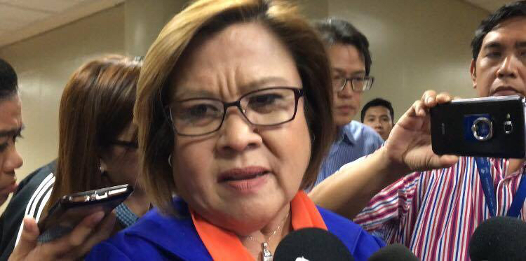 WIRETAPPING. Senator Leila De Lima cries foul over the alleged wiretapping of her mobile phones, saying it violates her right to privacy. Photo by Camille Elemia/Rappler  