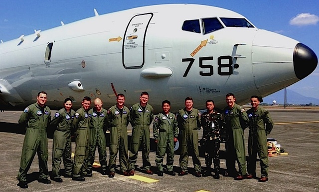 BILATERAL PATROL MISSION: Filipino pilots pose with aircrew members of Combat Air Crew Four and a P-8A Poseidon. US Navy photo 
