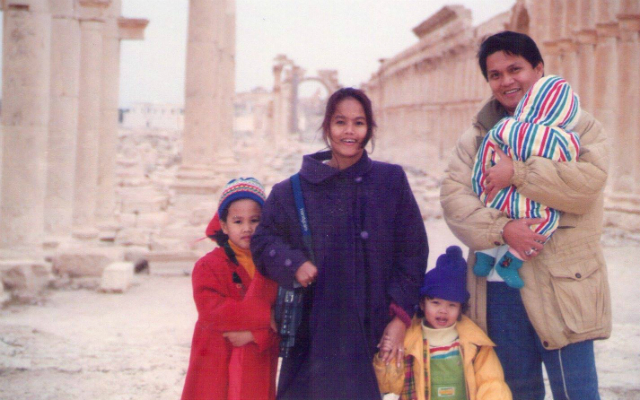 MIGRANTS. A family photo of the author (yellow jacket) in Palmyra, Syria. Photo courtesy of Migel Estoque