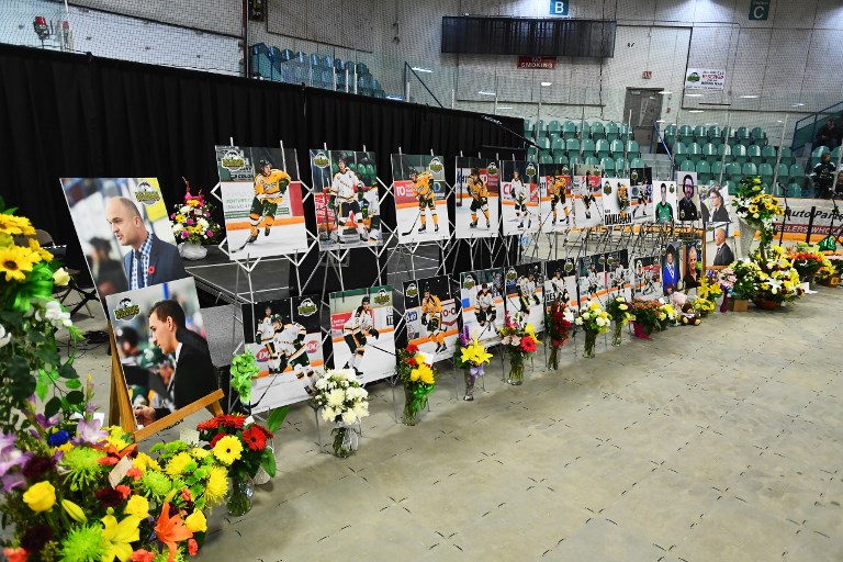 IN MEMORIAM. Photos of people involved in a fatal bus crash are seen prior to a vigil at the Elgar Petersen Arena, home of the Humboldt Broncos in Humboldt, Canada, April 8, 2018. File photo by Jonathan Hayward/Pool/AFP 