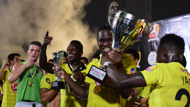 Tishan Hanley (holding trophy) was substituted in favor of Louis Clark (far left) despite scoring the opening goal. The League's cap on foreigners may have been a deciding reason. Photo by Bob Guerrero/Rappler  