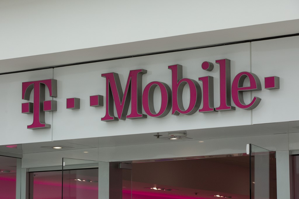 T-MOBILE. The T-Mobile logo is seen outside a shop in Washington, DC, on July 26, 2019. Photo by Alastair Pike/AFP 