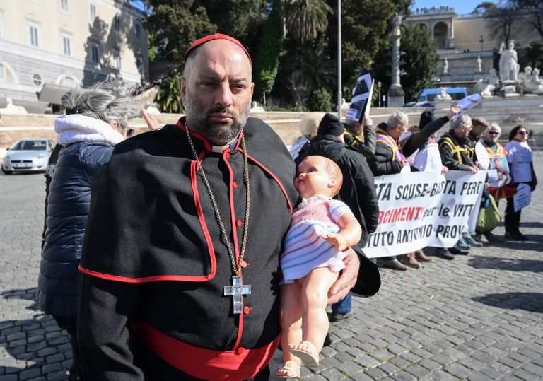 PROTEST. A deaf-mute person dressed as a Cardinal takes part in a protest of victims of sexual abuse and members of Ending Clergy Abuse (ECA), a global organization of prominent survivors and activists who are in Rome for this weekâs papal summit on the sex abuse crisis within the Catholic Church, on February 23, 2019 on Piazza del Popolo in Rome. Photo by Vincenzo Pinto/AFP 