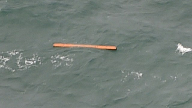 PLANE DEBRIS? This aerial view taken from an Indonesian search and rescue aircraft over the Java Sea shows floating debris spotted in the same area as other items being investigated by Indonesian authorities as possible objects from missing AirAsia flight QZ8501 on December 30, 2014. Photo by Bay Ismoyo/AFP 