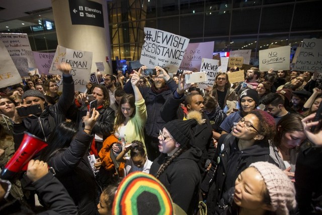DEMONSTRATION. Protesters rally against the new ban on immigration issued by US President Donald Trump at Logan International Airport in Boston, Massachusetts on January 28, 2017. Photo by Scott Eisen/Getty Images/AFP 