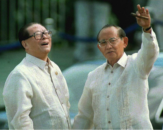 FRIENDLY TIES. Chinese President Jiang Zemin (left) looks up laughing as Philippine President Fidel V. Ramos gestures following Jiang's arrival for the Asia-Pacific Economic Cooperation (APEC) forum in Subic Bay, November 25, 1996. Photo by Yoshikazu Tsuno/AFP 