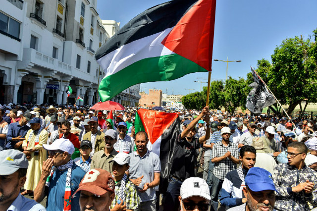 OPPOSITION. Protesters march with Palestinian flags during a demonstration in the Moroccan capital Rabat on June 23, 2019 against the US-led economic conference in Bahrain with its declared aim of achieving Palestinian prosperity. Photo by AFP 