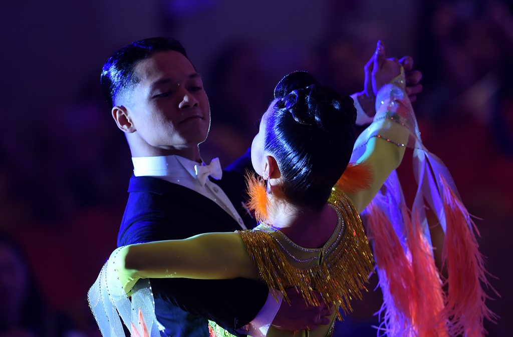 DANCESPORT. The Philippines' Sean Mischa Aranar (L) and Ana Leonila Nualla (R) perform during the dancesport event in the Southeast Asian Games in Clark, Capas, Tarlac on December 1, 2019. Photo by Wakil Kohsar/AFP 