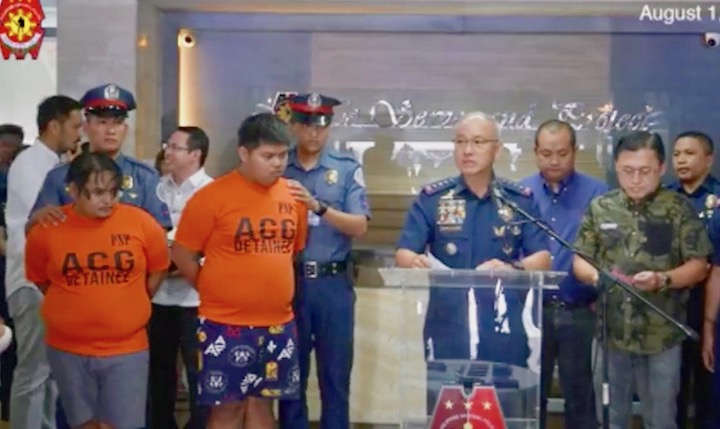 ARRESTED. The alleged scammers are presented at Camp Crame, violating the Philippine National Police's own rule against trial by publicity. Screenshot from PNP video 