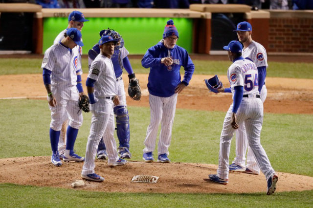 WILL THERE BE A GAME 7? The Chicago Cubs look to extend the World Series to a deciding Game 7. Manager Joe Maddon (C) says it's all up to his team come Game 6. Jamie Squire/Getty Images/AFP  