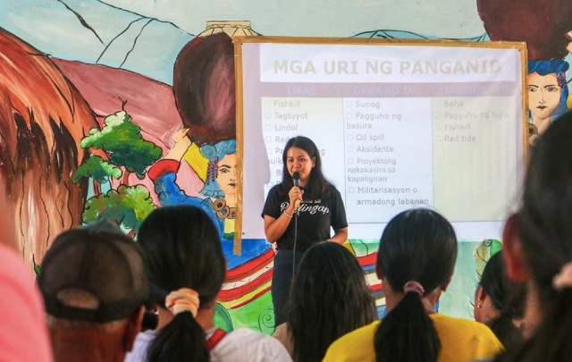 EDUCATION. Patis Mungcal orients a community on disaster risk reducation management. Photo courtesy of Mungcal 
