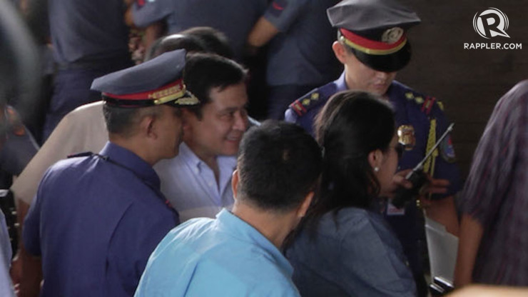 SURRENDER. Senator Jinggoy Estrada (2nd from left) arrives at the PNP Multipurpose Hall, 23 June 2014. Franz Lopez/Rappler