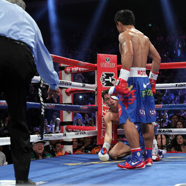 KNOCKDOWN. Manny Pacquiao stares down Chris Algieri after knocking him down. Photo from Pacquiao's Twitter account